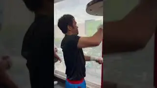 PACQUIAO SHOWING POWER ON THE HEAVY BAG