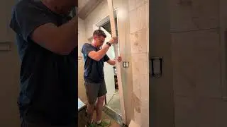 installing custom trim work around our bathroom door #diy #bathroomrenovation