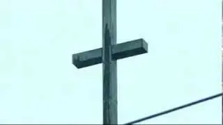 Faithful see Virgin Mary on water stained cross.