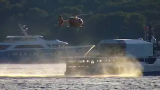 Helicopter takes off from the superyacht support vessel 'Power Play'