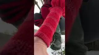 Walking in hunters in the snow socks leg warmers by railway bridge canal