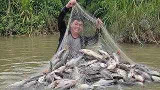 Having caught a large haul of fish, Trieu Din and little May enjoyed a delicious meal.