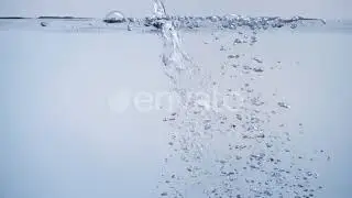 Clean Water Flowing with Bubbles of Air and Splashes on White Background | Stock Footage