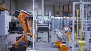 Robot automation for a trimming press / Industrieroboter an der Abgratpresse