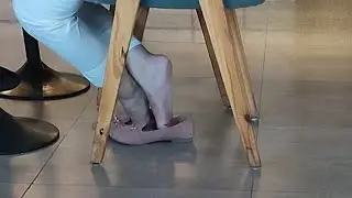 Candid flats shoeplay under chair | Full video available