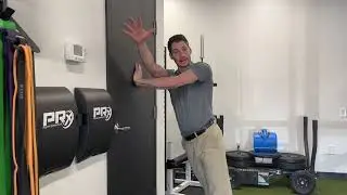 Wall shoulder internal rotation reach drill
