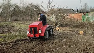 The mini-tractor with caterpillar tracks has emerged from its winter hibernation.