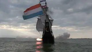 Early 17th century ship under sail and firing her guns.