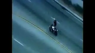 Crazy Motorcyclist Does Stunts While Being Chased By Cops