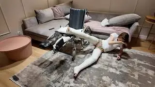 Girl in a wheelchair with both legs in long casts - she fell from the wheelchair to the ground :(