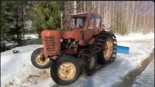 Belarus МТЗ-50 transfer of wet snow with a rear blade