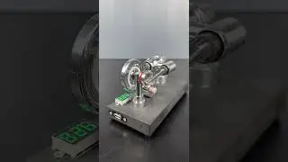 Mirror polished Stirling engine with embedded voltmeter and USB plug