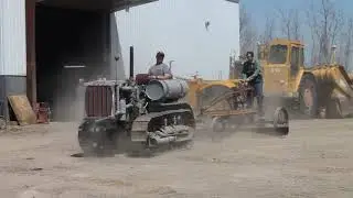 Cat thirty with pull grader.
