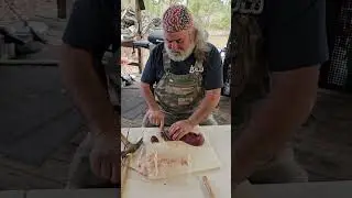 Making a knife out of bamboo.
