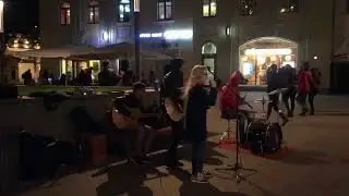 Beautiful girl with an angel voice singing in the street