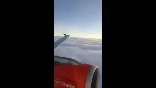 SAS Airbus A319 rise above the clouds to beautiful sky
