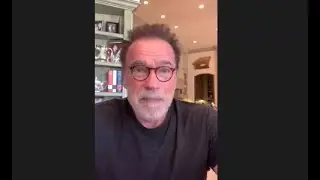 Arnold Schwarzenegger talks with poll worker trainees