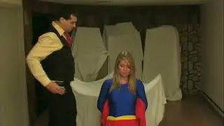Superheroine Sucker Punched By A Bad Guy