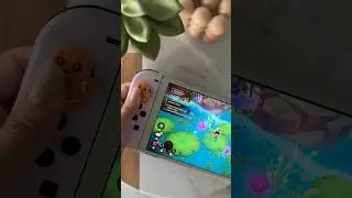 Gingerbread switch thumb grips while playing a cozy game