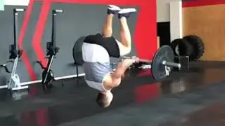 Weight Lifter Lands A Back Flip While Lifting An Olympic Bar