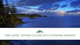 Time-lapse - Moving Clouds with a Standing Rainbow