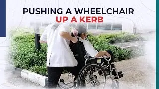 Pushing a Wheelchair Up a Kerb