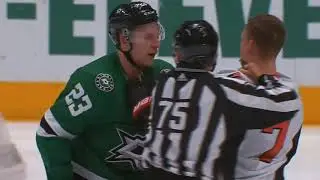 Esa Lindell hipchecks Brady Tkachuk