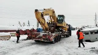 Transporting the last 2 excavators. Working with two truck cranes.