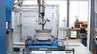 Production assembly of a tire rim using a robotic screwdriving machine