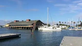 Long-Legged John sketchy dock landing on new 6’ 11” Sky SUP windsurf foil board