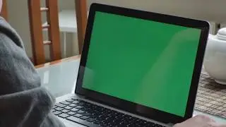 A man with laptop display in green screen- Stock Video Footage laptop green screen for mock up