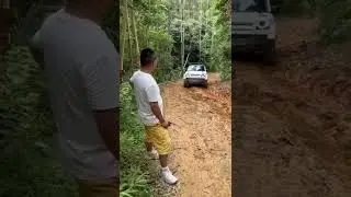 Defender Land Rover off road in rain forest