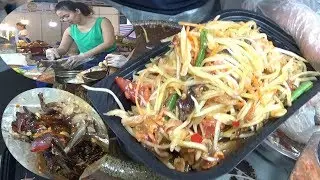 Hard working girl selling CRAB PAPAYA SALAD - People are waiting to buy a lot - Thailand Food Fair