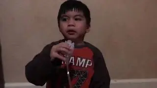 Toddler showing how to use nebulizer