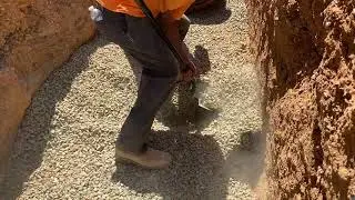 Excavating a Bell Hole for 24-inch Pipe Installation