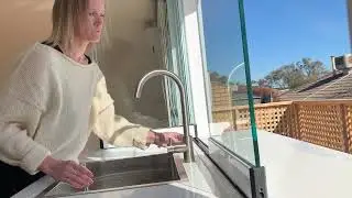 Clear Edge Servery Window opening past a kitchen tap