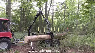 Timber trailer Vahva Jussi and small tractor Belarus