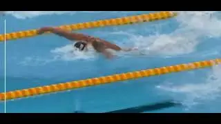 Caeleb butterfly swimming chest in the water