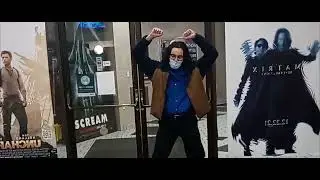 Entering a movie theater playing 