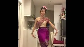 Thai transgender woman getting dress in Thai traditional clothes