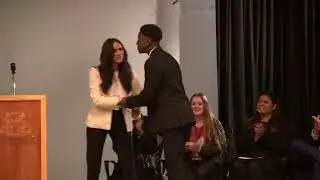Head boy steals a kiss and a hug Meghan Markle at Robert Clack Upper School