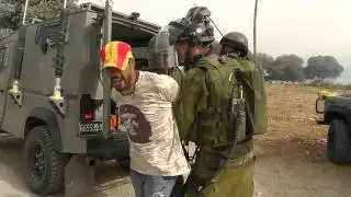Ashraf Abu Rahmah, brother of two Bi'lin casualties, arrested during protest