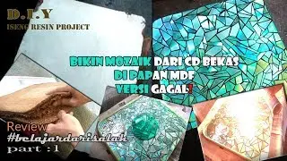 Make a mosaic from an old cd on the mdf board with resin.  failed Version! 