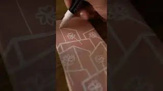 Painting towers and flowers on miniature tiles