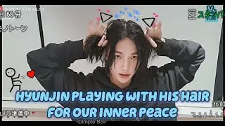 Hyunjin playing with his hair for our inner peace💙