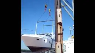 Boat over 50 feet dropped by crane into the river during ship transporting.