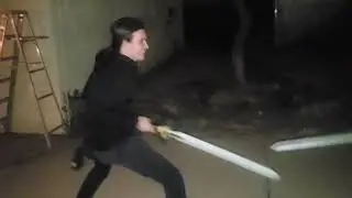Two dudes sword fighting.