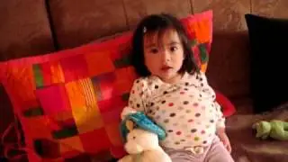 Toddler sitting and walking like a pregnant mother