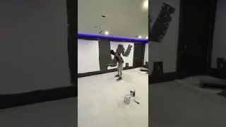 Satisfying paint roller painting a wall