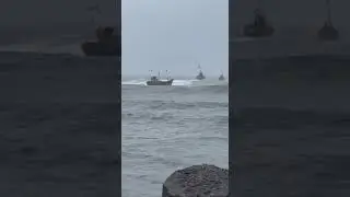 Bad weather fishing boat work at sea..